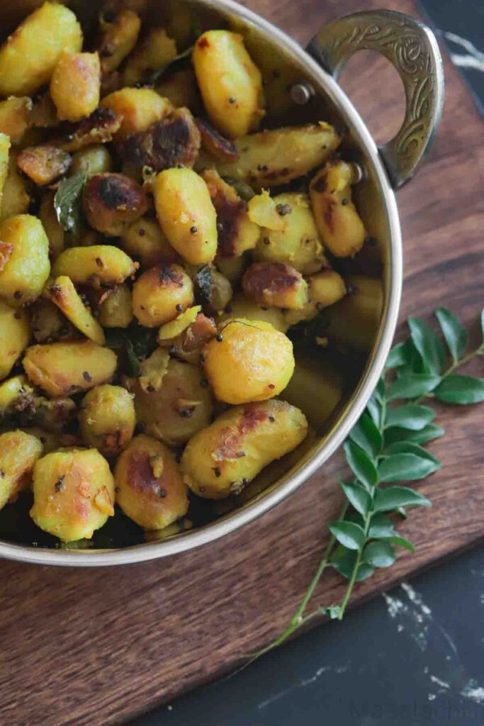 close up view of Koorka Mezhukkupuratti or stir fried chinese potato