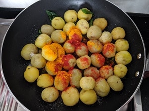 Peeled baby potatoes with spices and seasoning