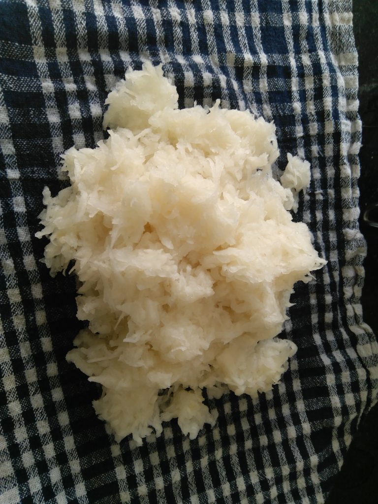 Excess moisture from radish to be squeezed