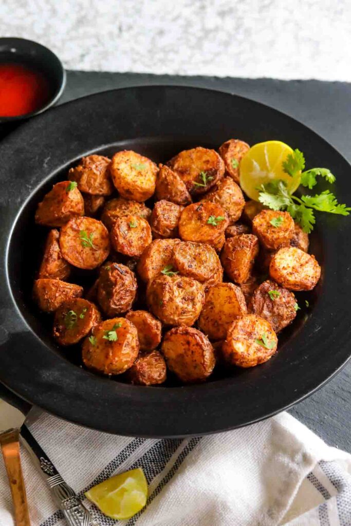 Air Fryer Roasted potatoes served with lime wedge