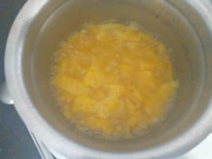 Pineapples getting cooked and turning slightly mushy (water volume has reduced)