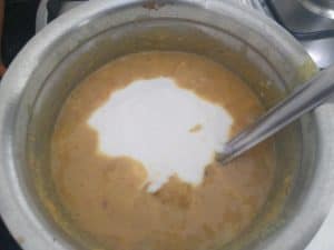 Adding Whisked curd and switching off the flame