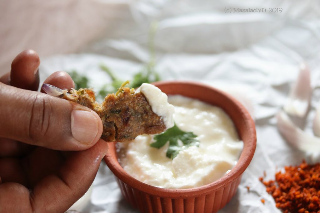 Enjoy piping hot thalipeeth dipped in a bowl of curd