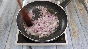 sauteeing the onions in oil with cumin