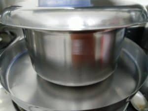 Cover the batter with lid and place a plate below to avoid spillage