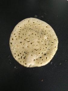 Surnoli being cooked on griddle