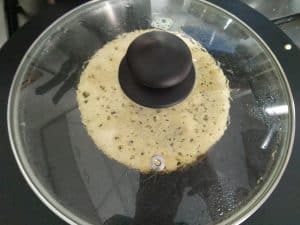 covering the Jackfruit seed surnoli with a lid enables spongy dosas