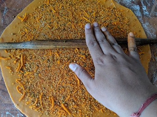 Press the filling with rolling pin