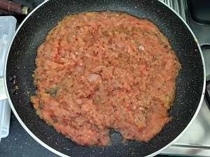 tomato puree added to the onion, ginger garlic mix