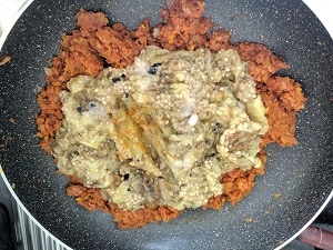 roasted and mashed eggplant added to the curry base
