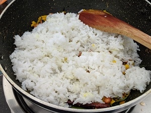 Adding cooked rice to nellikai mix
