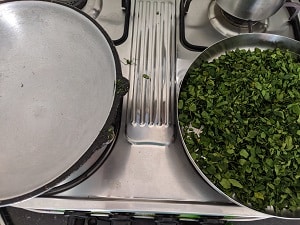 Dry roasting the moringa leaves