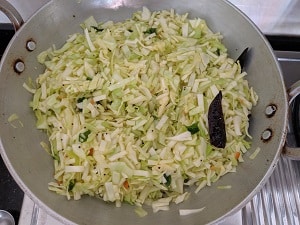 Water is added to cook the cabbage