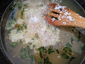 Adding Coconut to the millet kozhukattai mix