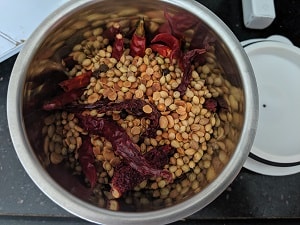 Grinding the sambar powder ingredients