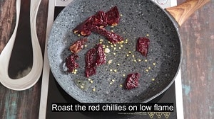 roasting whole dry red chilies for sundal masala