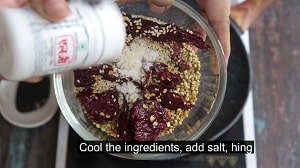 cool the roasted lentils, red chilies, salt and hing for making sundal podi