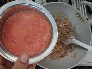 Adding the tomato puree