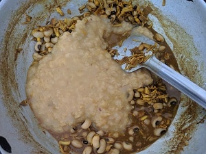 Adding cooked dal to the vazhaipoo mix