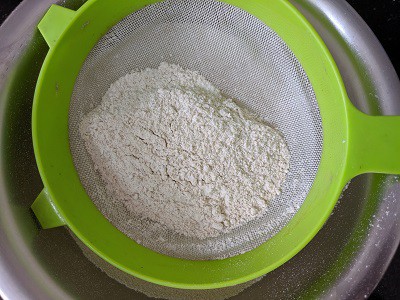 Sifting the Jowar Flour or Cholam Maavu