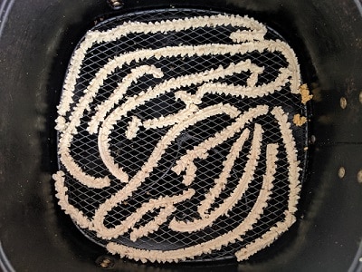 preheat the air fryer and press the chakli