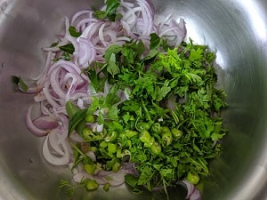 Sliced onions, coriander leaves and green chilies finely chopped for the pakodas
