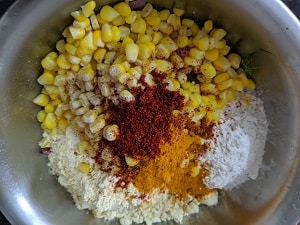 Red Chilli powder, salt to taste and turmeric powder with hing are added