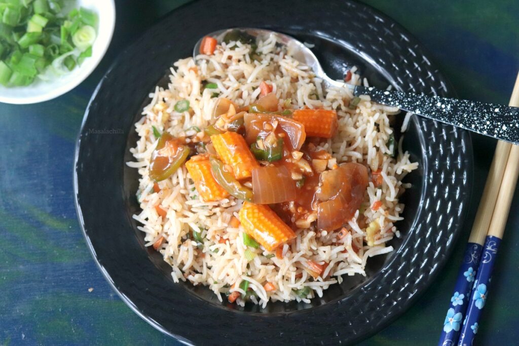 Vegetable Fried Rice served with vegetables in hot garlic sauce