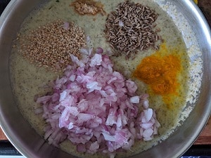 Other ingredients for the moong chilla - onions, cumin, hing, turmeric, sesame seeds