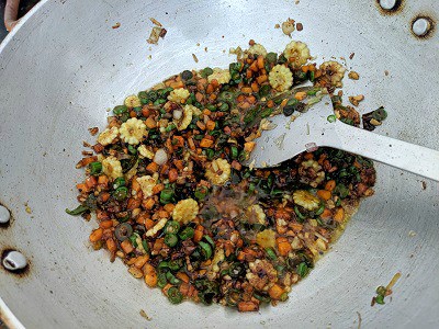 Adding a mix of sauces - soy, red chilli and green chilli