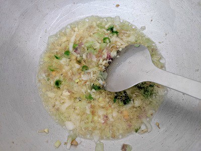 Ginger, Garlic, Green Chillies and onions cooking in hot oil