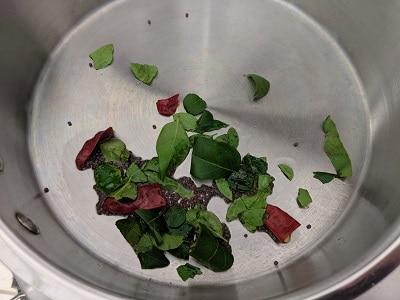 Tempering for Sundal - Coconut oil, mustard seeds, whole red chillies and curry leaves