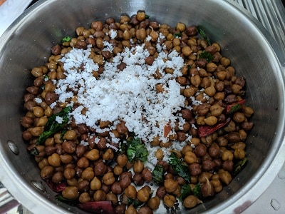 Freshly grated coconut is added to the chickpeas