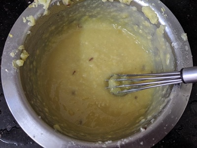 Whisk and mash the pressure cooked paruppu or dal