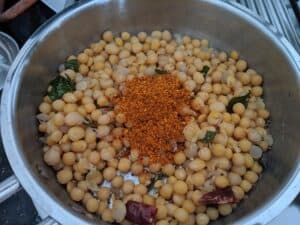 Spicy sundal masala added to the cooked peas