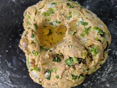 kneading the dough and adding oil to prevent from drying