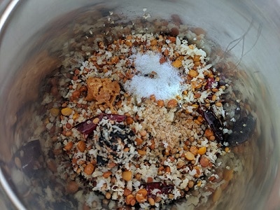 Ingredients ready to be ground for sutta kathirikkai chutney - roasted eggplant with lentils, coconut, red chillies, tamarind, hing, jaggery and salt to taste