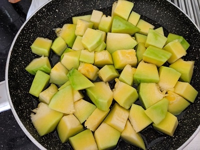 Chopped pumpkin cooking in water