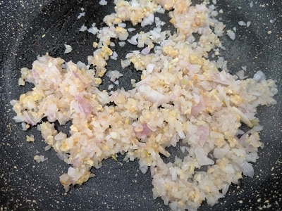 Sauteing the onions and garlic in olive oil for the sauce