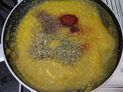 Pumpkin puree and spices added to the caramelized onions and garlic