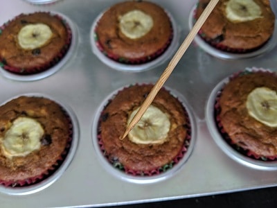 The banana chocolate chip muffins are ready when the skewer or toothpick is clean.