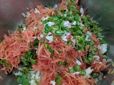 Vegetables and coriander stems added to the mix