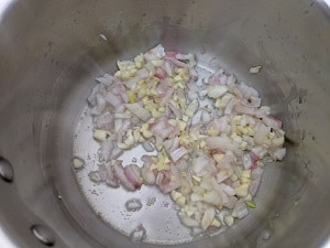 Onion and Garlic sauteing in olive oil for tomato soup