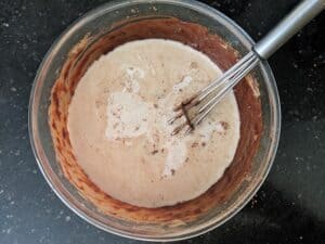 Adding milk to the chocolate