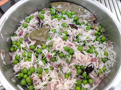 Peas Pulao ready to be pressure cooked