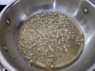 Chopped Garlic cooking in olive oil