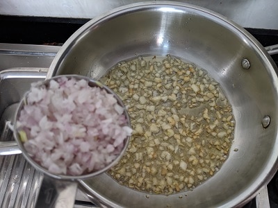 Onions added to the chopped garlic