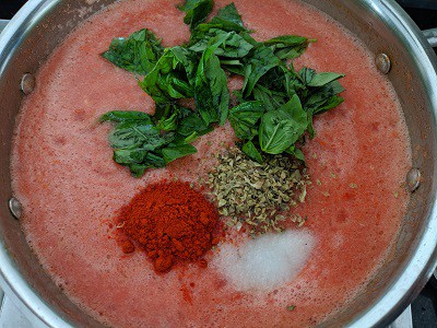 Herbs added to the tomato puree