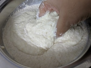 Mix the batter with hands to aid fermentation
