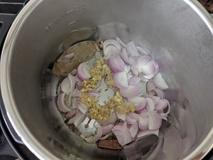 Saute Onions and whole spices with cumin seeds in olive oil